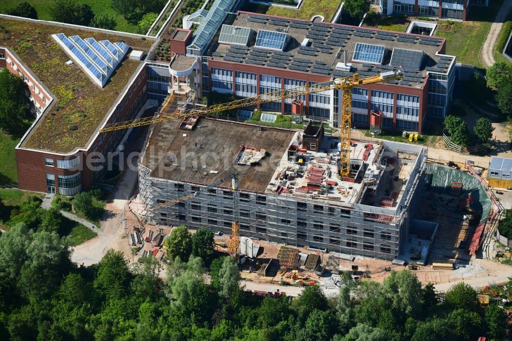 Regensburg from the bird's eye view: Construction site for a new extension to the hospital grounds Universitaetsklinikum Regensburg on Franz-Josef-Strauss-Allee in Regensburg in the state Bavaria, Germany