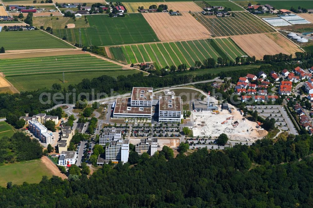 Bad Friedrichshall from the bird's eye view: Construction site for a new extension to the hospital grounds SLK-Kliniken Heilbronn GmbH - Klinikum on Plattenwald in Bad Friedrichshall in the state Baden-Wurttemberg, Germany