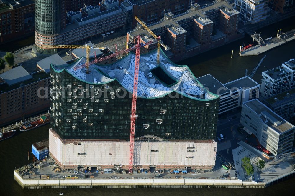 Hamburg from above - Construction site of the Elbe Philharmonic Hall on the banks of the Elbe in the warehouse district of Hamburg