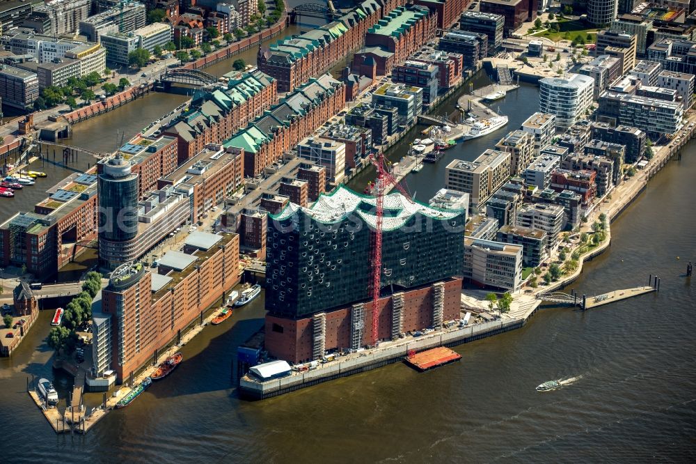 Hamburg from above - The Elbe Philharmonic Hall on the river bank of the Elbe in Hamburg. The building in the district HafenCity is still in process of construction