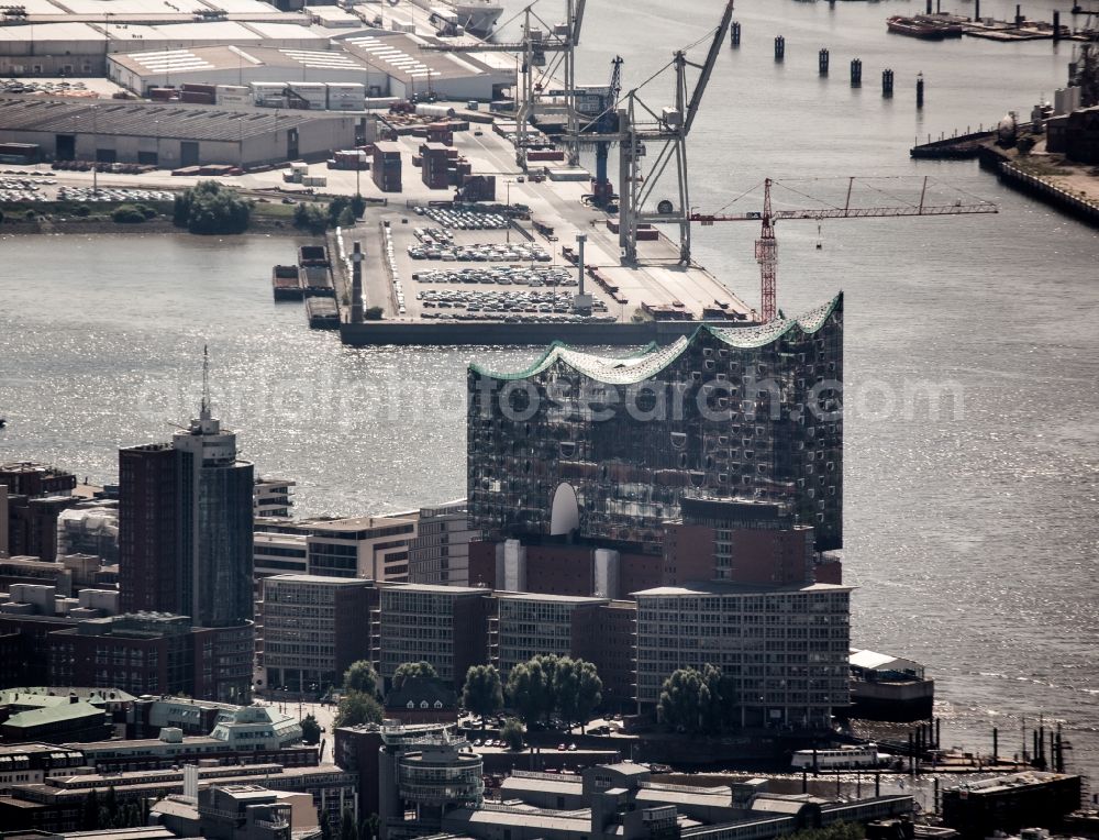 Hamburg from above - The Elbe Philharmonic Hall on the river bank of the Elbe in Hamburg. The building in the district HafenCity is still in process of construction