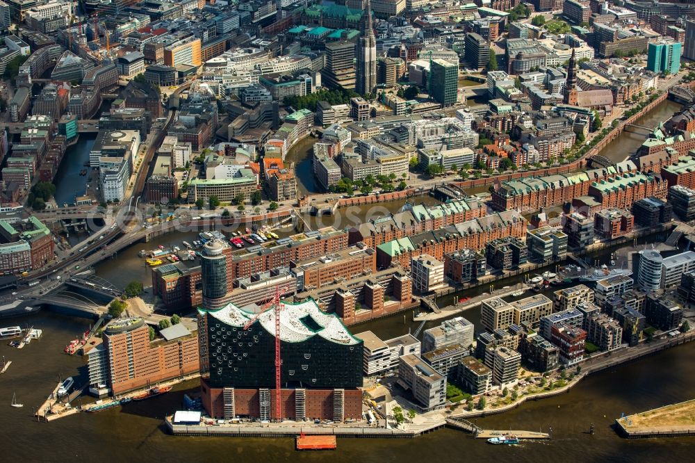 Hamburg from above - The Elbe Philharmonic Hall on the river bank of the Elbe in Hamburg. The building in the district HafenCity is still in process of construction