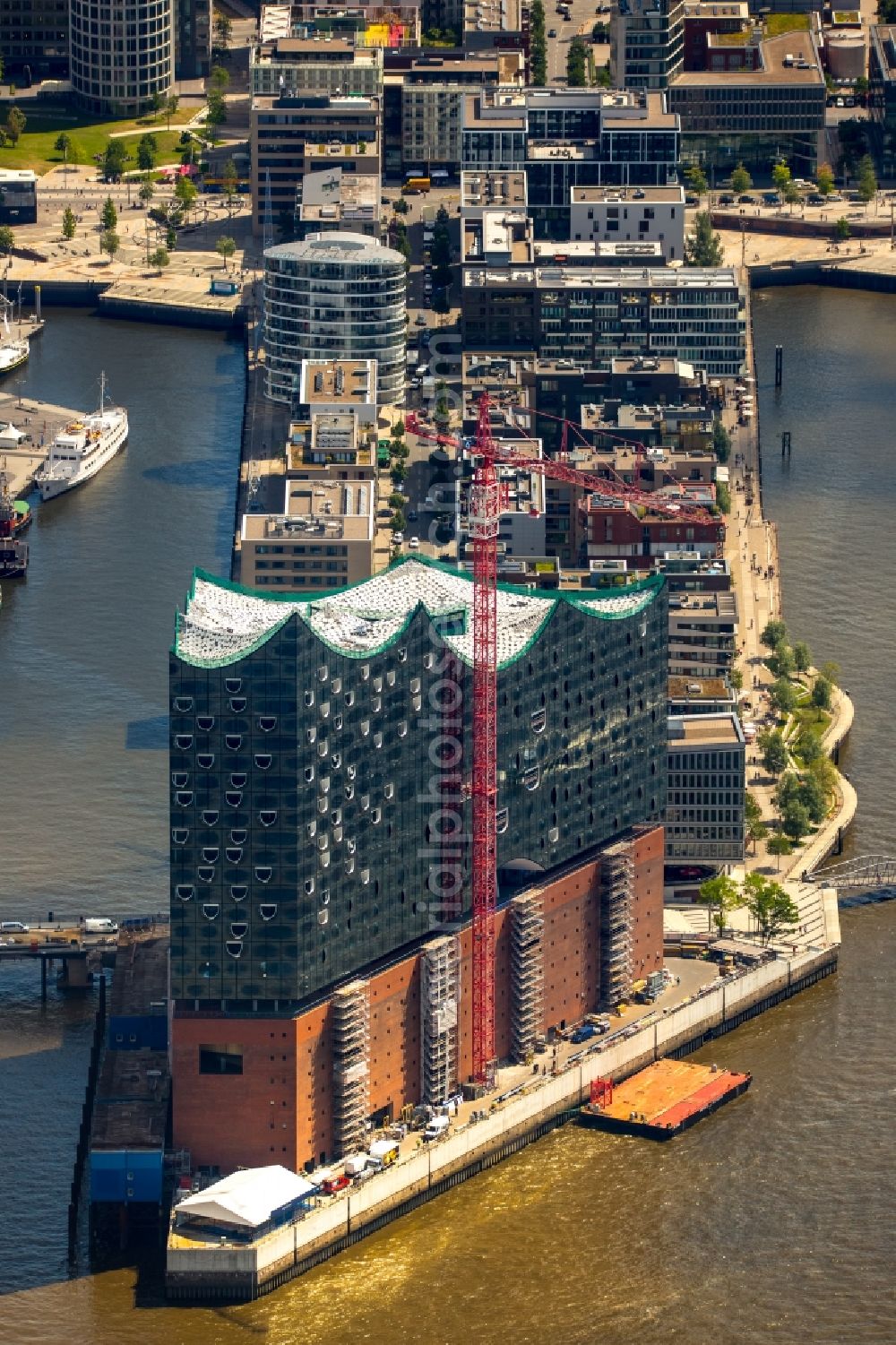 Hamburg from above - The Elbe Philharmonic Hall on the river bank of the Elbe in Hamburg. The building in the district HafenCity is still in process of construction