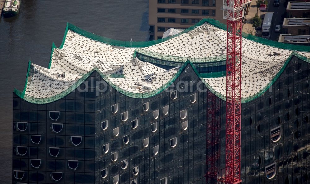 Hamburg from the bird's eye view: The Elbe Philharmonic Hall on the river bank of the Elbe in Hamburg. The building in the district HafenCity is still in process of construction