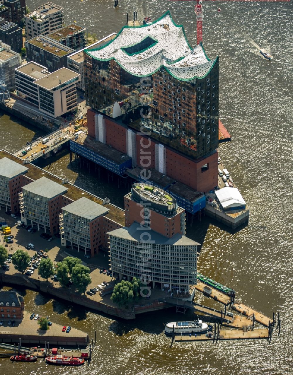 Hamburg from above - The Elbe Philharmonic Hall on the river bank of the Elbe in Hamburg. The building in the district HafenCity is still in process of construction