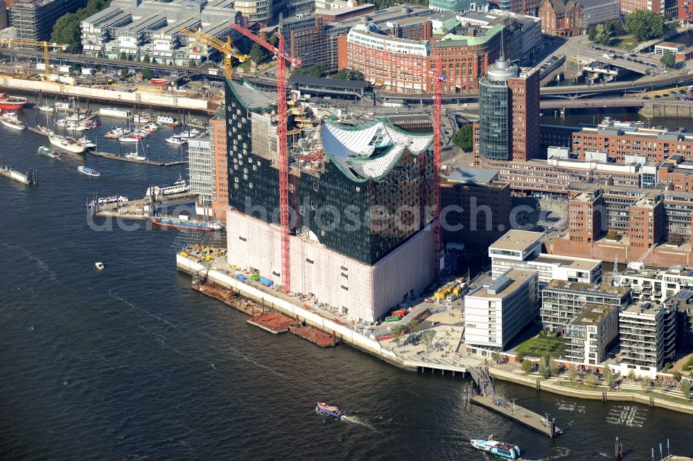 Hamburg from above - The Elbe Philharmonic Hall on the river bank of the Elbe in Hamburg. The building in the district HafenCity is still in process of construction