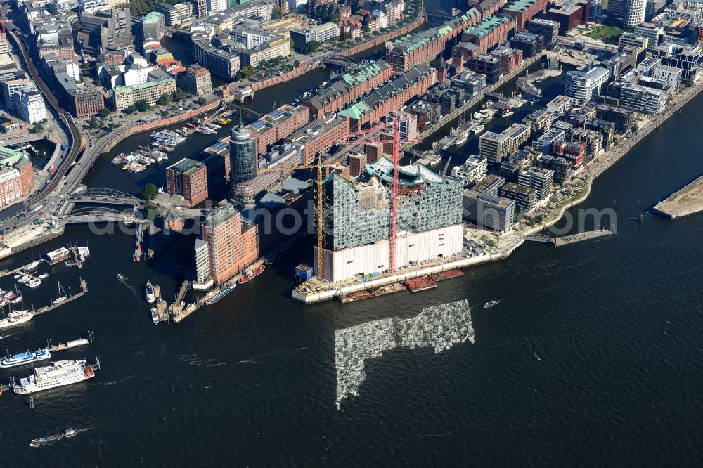 Hamburg from the bird's eye view: The Elbe Philharmonic Hall on the river bank of the Elbe in Hamburg. The building in the district HafenCity is still in process of construction