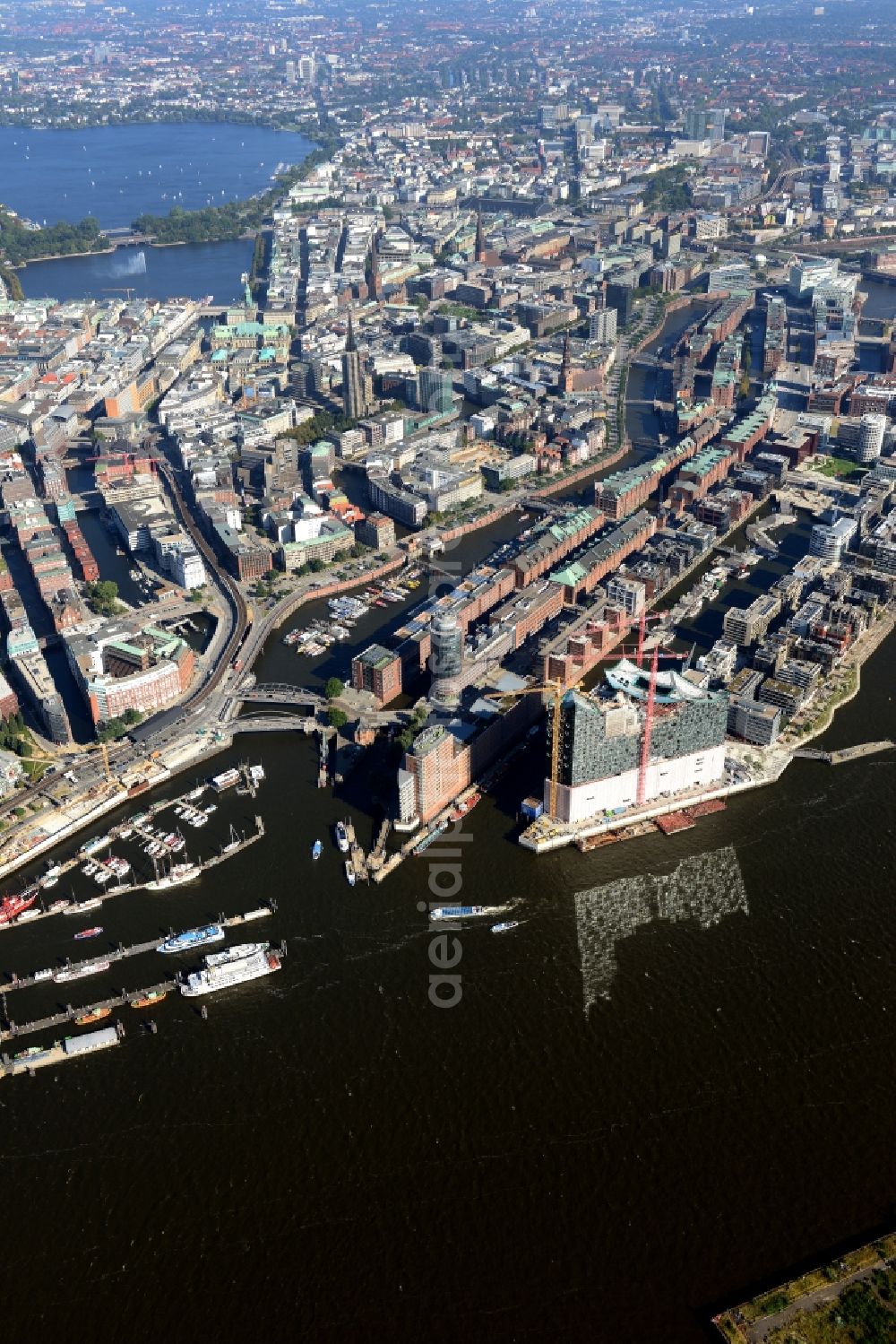 Hamburg from above - The Elbe Philharmonic Hall on the river bank of the Elbe in Hamburg. The building in the district HafenCity is still in process of construction