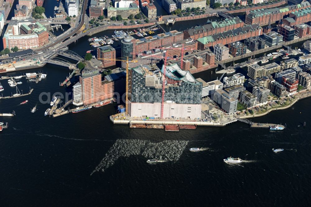 Aerial image Hamburg - The Elbe Philharmonic Hall on the river bank of the Elbe in Hamburg. The building in the district HafenCity is still in process of construction