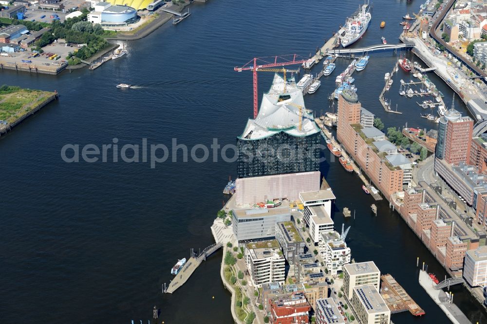 Hamburg from above - The Elbe Philharmonic Hall on the river bank of the Elbe in Hamburg. The building in the district HafenCity is still in process of construction