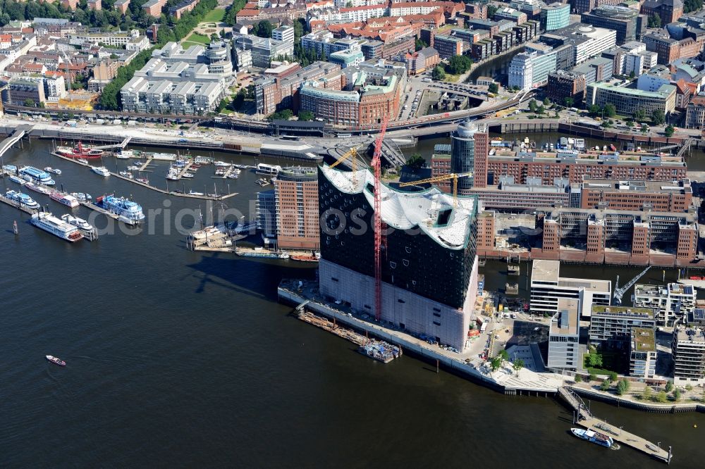 Hamburg from above - The Elbe Philharmonic Hall on the river bank of the Elbe in Hamburg. The building in the district HafenCity is still in process of construction