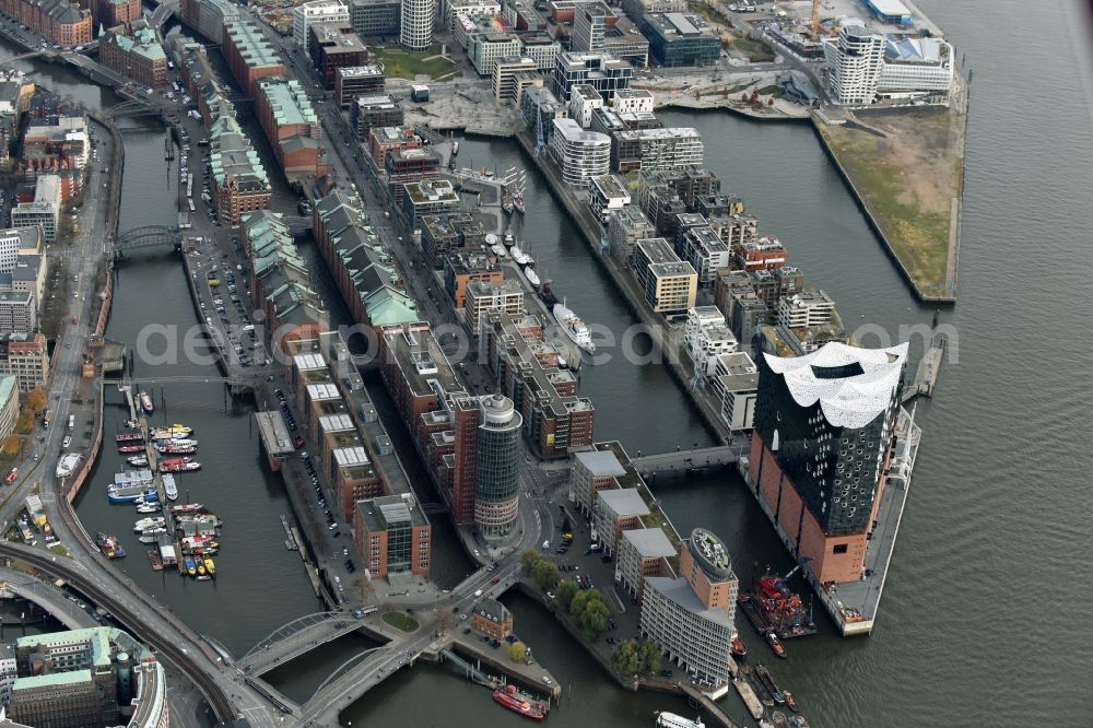 Hamburg from above - The Elbe Philharmonic Hall on the river bank of the Elbe in Hamburg. The building in the district HafenCity is still in process of construction