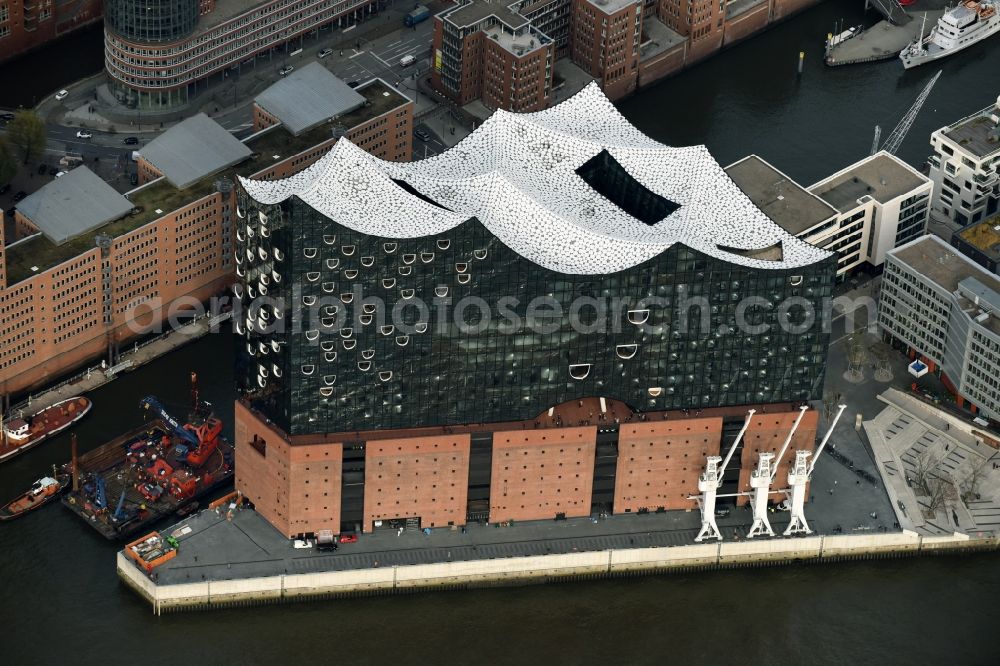 Hamburg from above - The Elbe Philharmonic Hall on the river bank of the Elbe in Hamburg. The building in the district HafenCity is still in process of construction