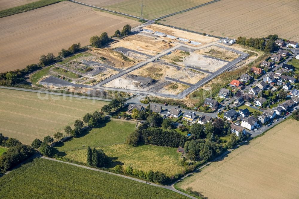 Holzwickede from above - Construction site with development works and embankments works at the new residential park Emscherquelle on the site of the former Emscher barracks in Holzwickede in the state North Rhine-Westphalia, Germany