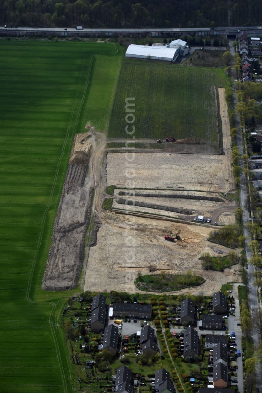 Rüdersdorf from the bird's eye view: Construction site with development works and embankments works on Gruenheider Weg in Ruedersdorf in the state Brandenburg