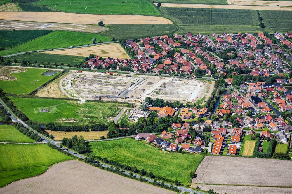 Krummhörn from the bird's eye view: Construction site with development works and embankments works Greetsiel in Krummhoern in the state Lower Saxony, Germany