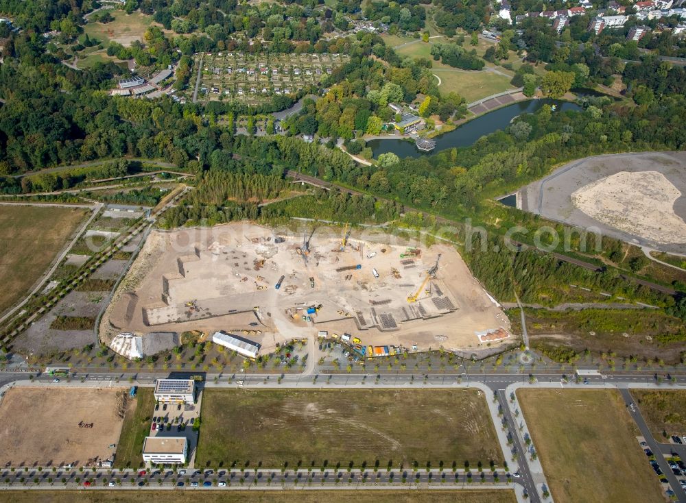 Dortmund from the bird's eye view: Construction site with development works and embankments works in the industrial area Phoenix-West and the ground of the former steal mill Hoeschin in Dortmund in the state North Rhine-Westphalia