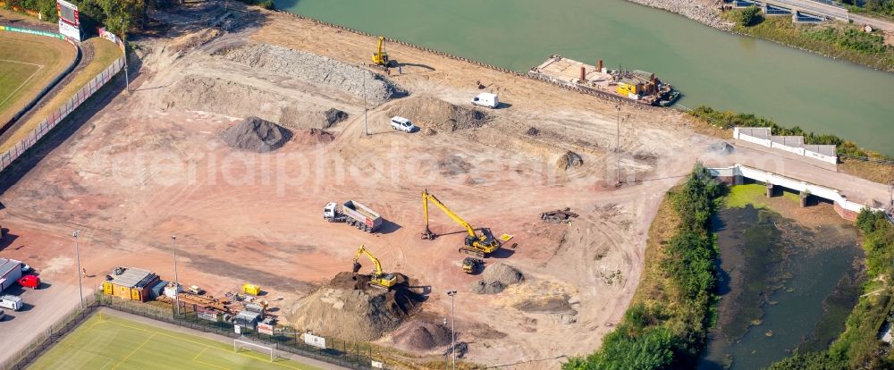 Hamm from the bird's eye view: Construction site with development works and embankments works der JOHANN BUNTE Bauunternehmung GmbH & Co. KG in Hamm in the state North Rhine-Westphalia. There are sport fields of the Sportzentrum Ost beneath the construction site