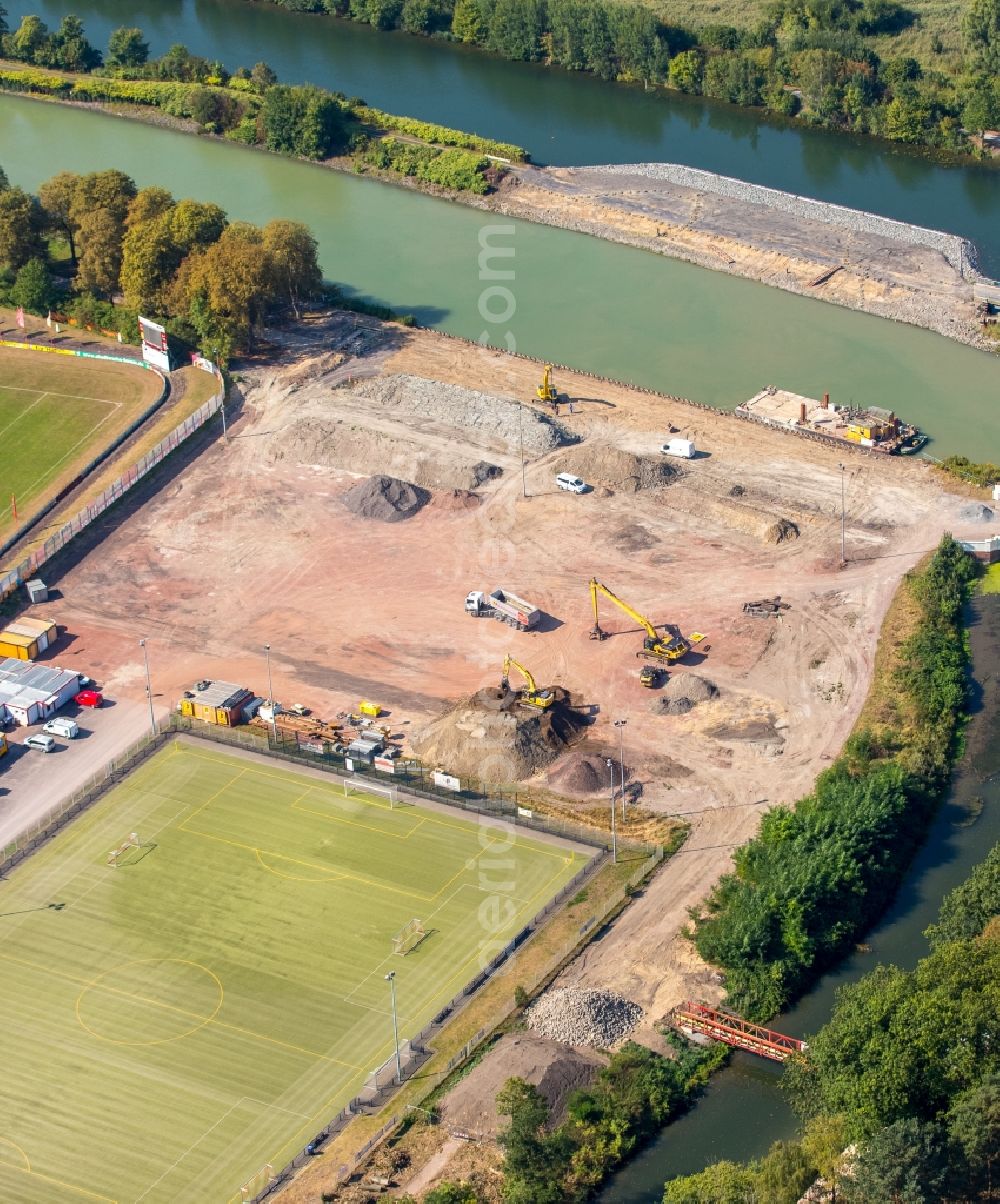 Aerial image Hamm - Construction site with development works and embankments works der JOHANN BUNTE Bauunternehmung GmbH & Co. KG in Hamm in the state North Rhine-Westphalia. There are sport fields of the Sportzentrum Ost beneath the construction site