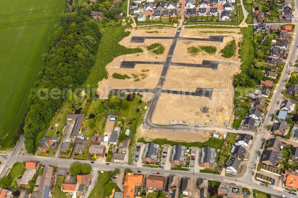 Aerial image Hamm - Construction site with development works and embankments works fuer den Neubau einer Einfamilienhaussiedlung in Hamm in the state North Rhine-Westphalia, Germany