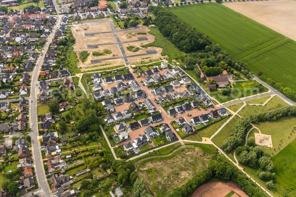 Aerial photograph Hamm - Construction site with development works and embankments works fuer den Neubau einer Einfamilienhaussiedlung in Hamm in the state North Rhine-Westphalia, Germany