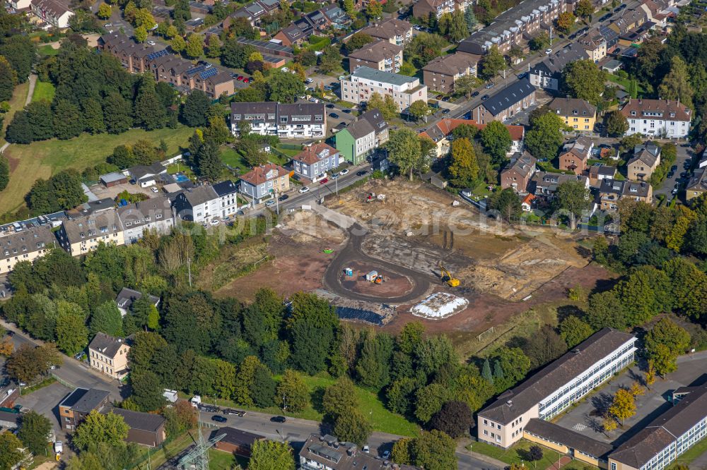 Essen from above - Construction site with development works and embankments works for the new city quarter Quartier der Generationen with swimming pool - indoor swimming pool in the district Bochold in Essen at Ruhrgebiet in the state North Rhine-Westphalia, Germany