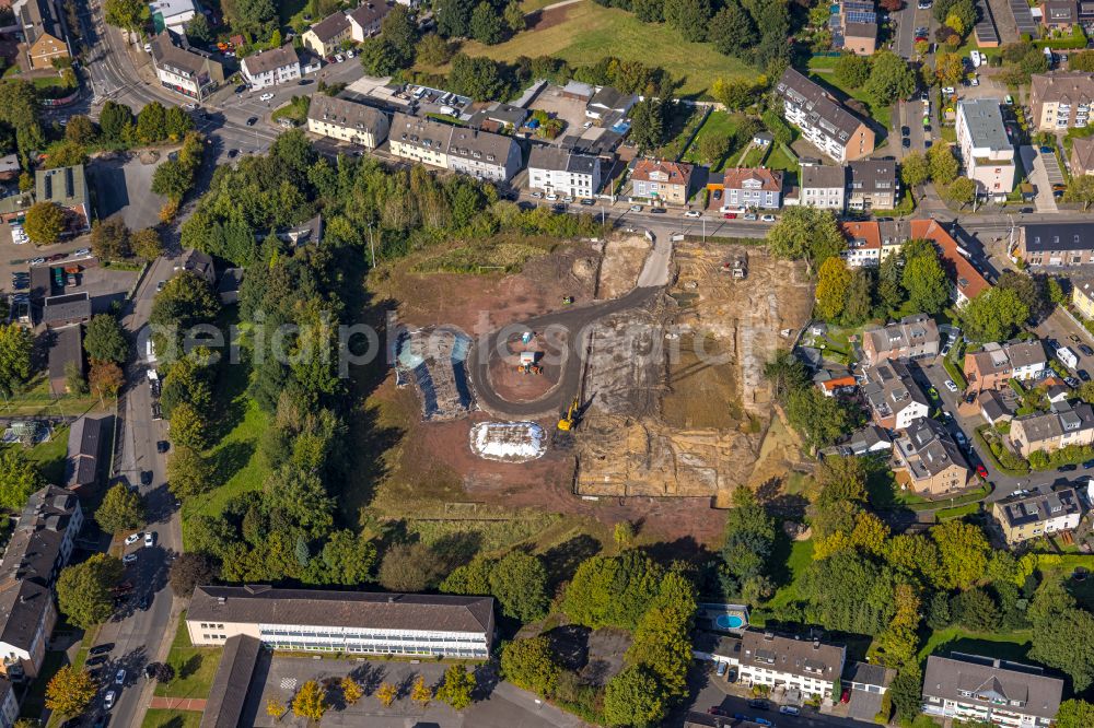 Essen from the bird's eye view: Construction site with development works and embankments works for the new city quarter Quartier der Generationen with swimming pool - indoor swimming pool in the district Bochold in Essen at Ruhrgebiet in the state North Rhine-Westphalia, Germany