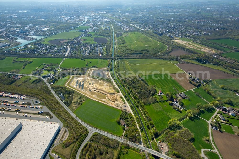 Dortmund from above - Construction site with development works and embankments works a rainwater retention basin in Dortmund in the state North Rhine-Westphalia