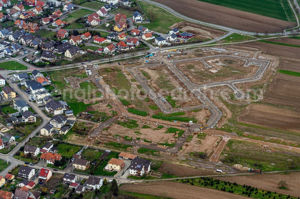 Rheinhausen from the bird's eye view: Construction site with development works and embankments works fuer ein Wohn Baugebiet in Rheinhausen in the state Baden-Wurttemberg, Germany