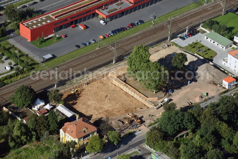 Dresden from the bird's eye view: Construction site with development works and embankments works for construction of micro apartments in the Wiener Strasse in Dresden in the state Saxony