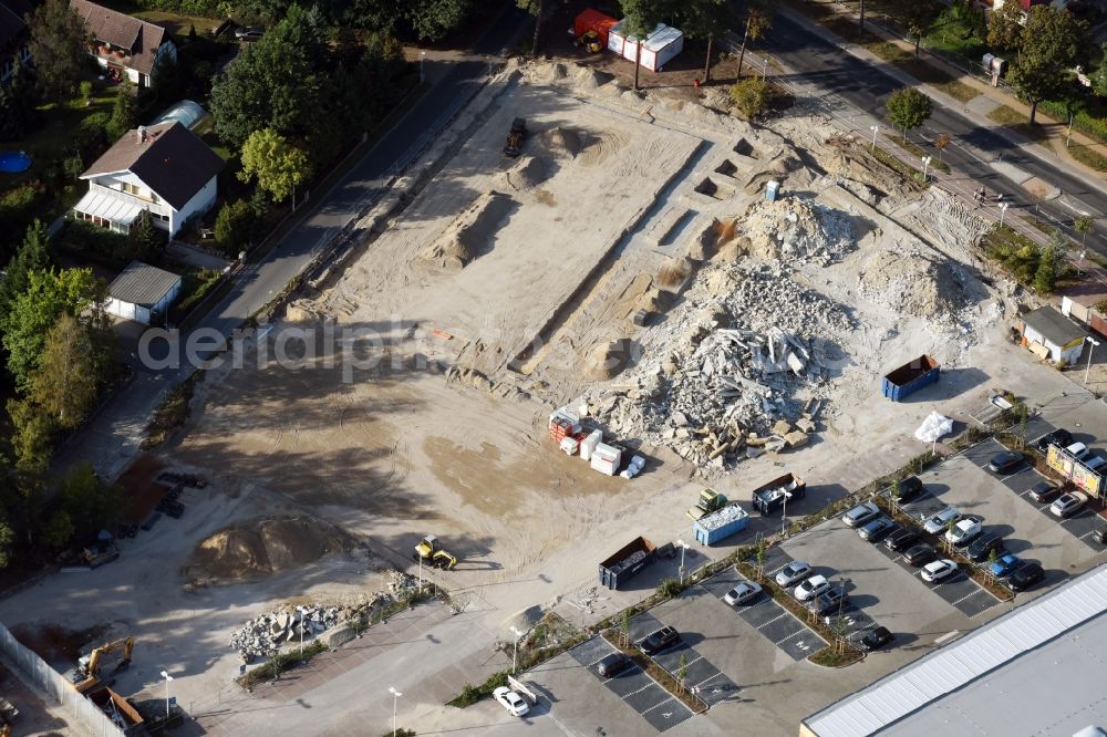 Hohen Neuendorf from above - Construction site of the GVG Projektentwicklungsgesellschaft mbH with development works and embankments works zur revitalisierung des Fachmarktzentrums HDZ at the Schoenfliesser Strasse in Hohen Neuendorf in the state Brandenburg