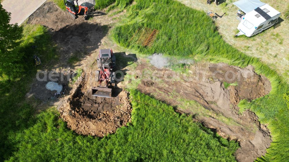 Groß Daberkow from the bird's eye view: Construction site with development, foundation, earth and landfill works for a single family home in Gross Daberkow in the state Mecklenburg - Western Pomerania, Germany