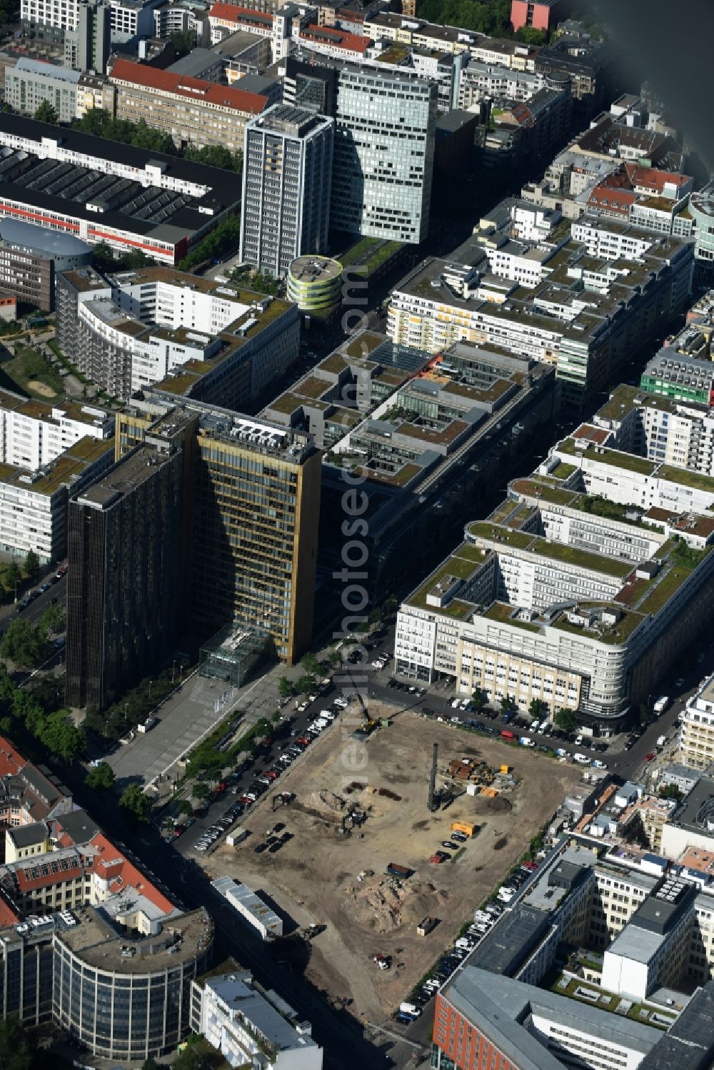 Berlin from above - Construction site with pile foundation work for the foundation plate of the new building Axel Springer Campus - OMA to Krausenstrasse - Schuetzenstrasse in Berlin