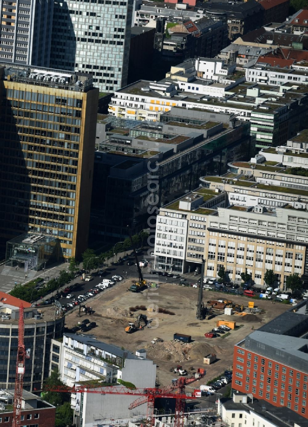 Berlin from above - Construction site with pile foundation work for the foundation plate of the new building Axel Springer Campus - OMA to Krausenstrasse - Schuetzenstrasse in Berlin