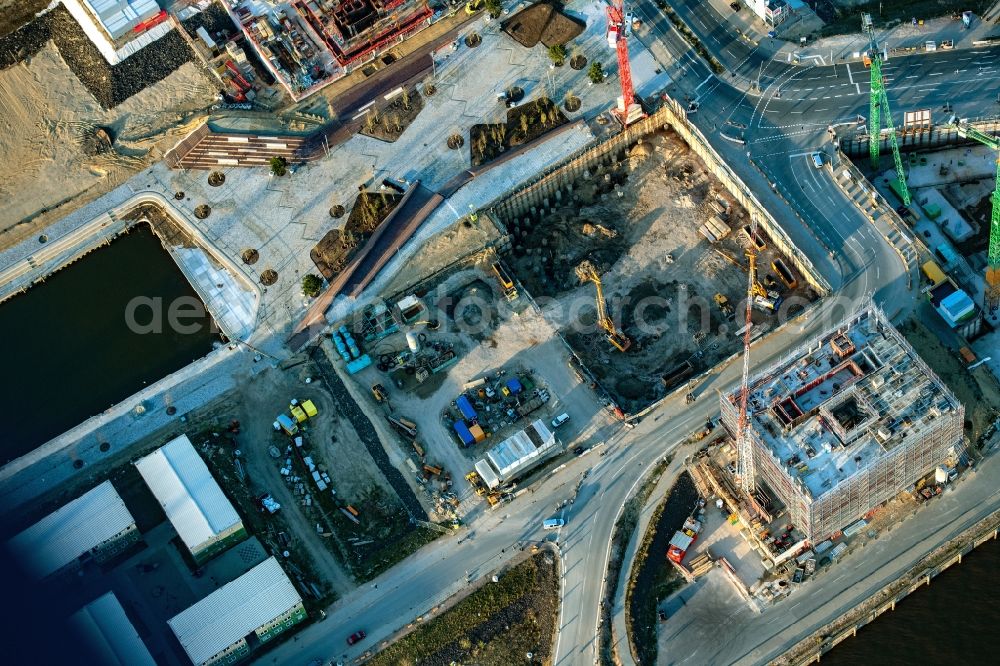 Hamburg from the bird's eye view: Construction site with piling works for the foundation slab of a new building on office ond commercial building in the district HafenCity in Hamburg, Germany