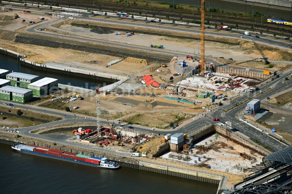 Hamburg from the bird's eye view: Construction site with piling works for the foundation slab of a new building on office ond commercial building in the district HafenCity in Hamburg, Germany