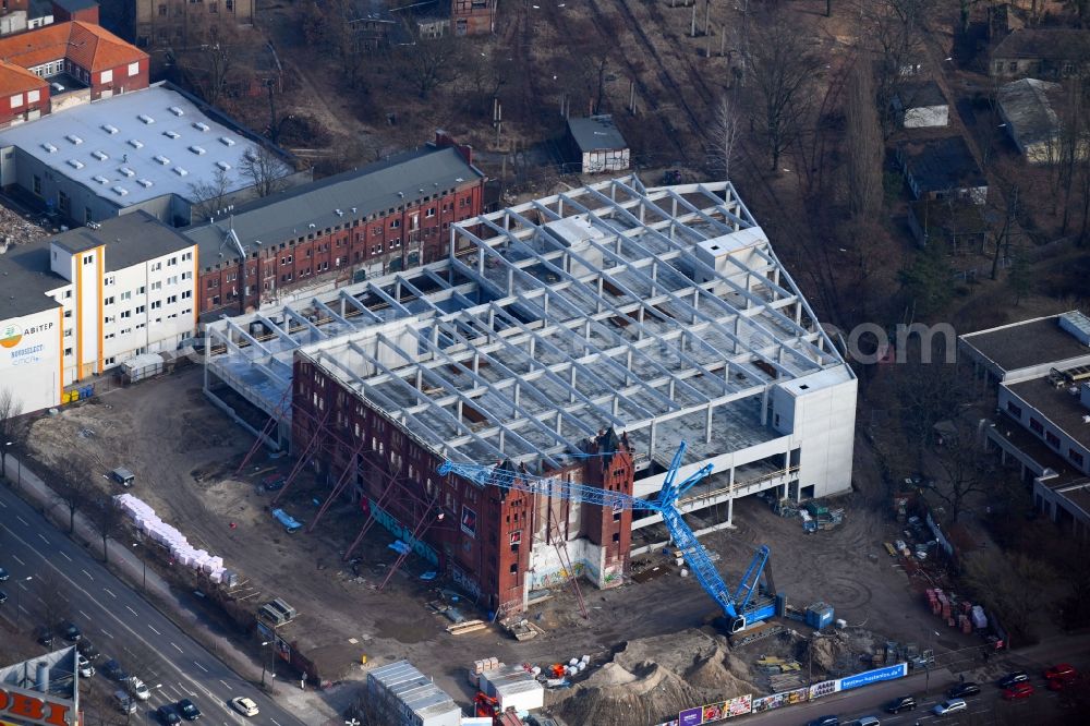 Berlin from above - Demolition site of the ruins of the factory building of the former BaerenSiegel distillery on Adlergestell in Adlershof, Berlin. At the construction site of the distinctive production building GDR times development a shopping center