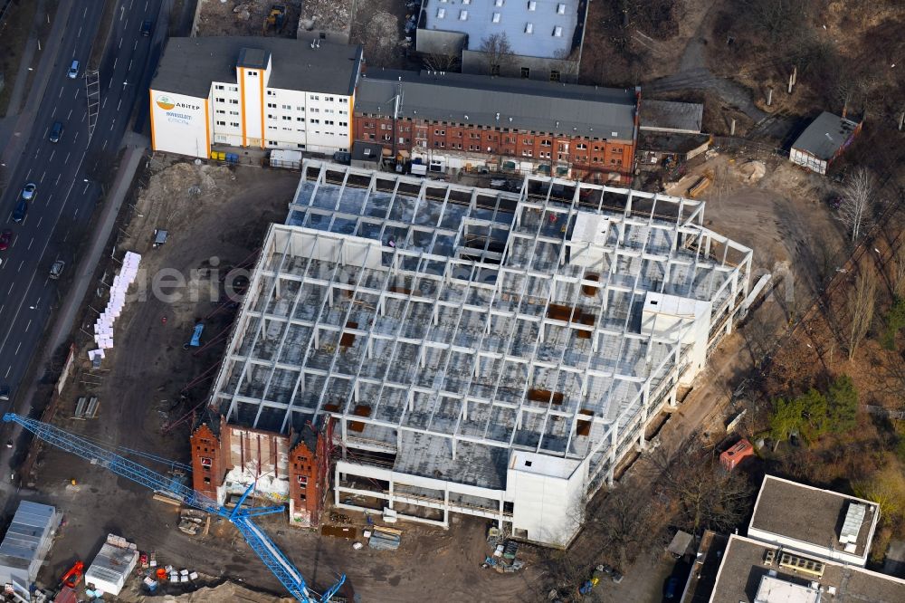 Aerial photograph Berlin - Demolition site of the ruins of the factory building of the former BaerenSiegel distillery on Adlergestell in Adlershof, Berlin. At the construction site of the distinctive production building GDR times development a shopping center