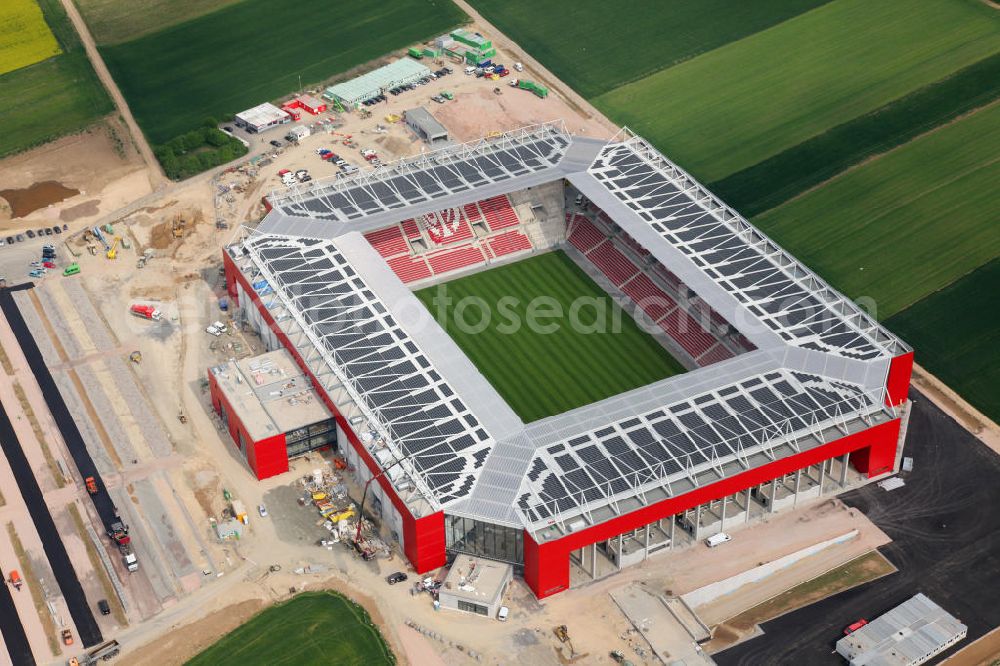 Mainz from the bird's eye view: Baustelle Fußball-Stadion Coface-Arena, neue Heimstätte des Vereins FSV Mainz 05. Das Dach der Tribüne ist mit einer Photovoltaikanlage / Solaranlage eingedeckt. Bauherr und Eigentümer des Neubauprojektes ist die stadteigene Grundstücksverwaltungsgesellschaft der Stadt Mainz mbH (GVG). Construction site of the stadium Coface-Arena in Mainz.