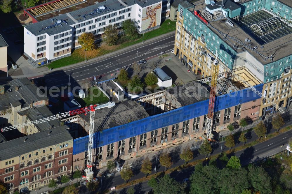 Leipzig from the bird's eye view: Construction site building complex of the ruins of the Bugra exhibition hall in Leipzig in Saxony. The Hildebrand & Juergens GmbH plans to historically appropriate renovation and remodeling of the historic building