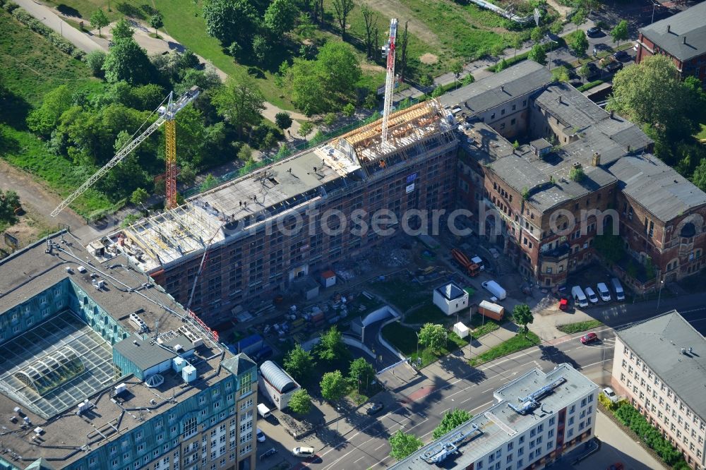 Aerial image Leipzig - Construction site building complex of the ruins of the Bugra exhibition hall in Leipzig in Saxony. The Hildebrand & Juergens GmbH plans to historically appropriate renovation and remodeling of the historic building