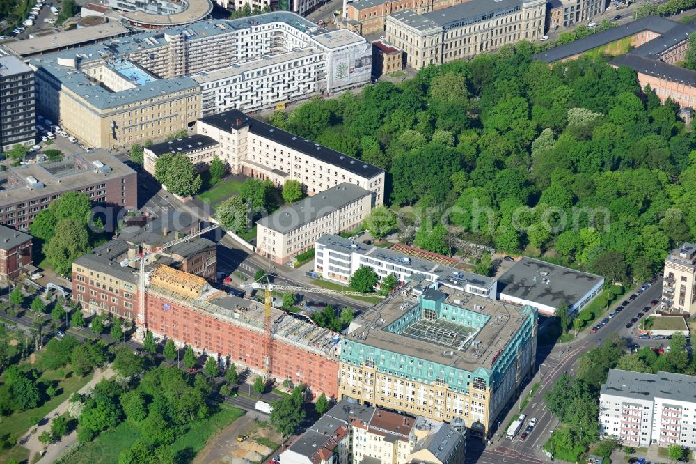 Leipzig from the bird's eye view: Construction site building complex of the ruins of the Bugra exhibition hall in Leipzig in Saxony. The Hildebrand & Juergens GmbH plans to historically appropriate renovation and remodeling of the historic building