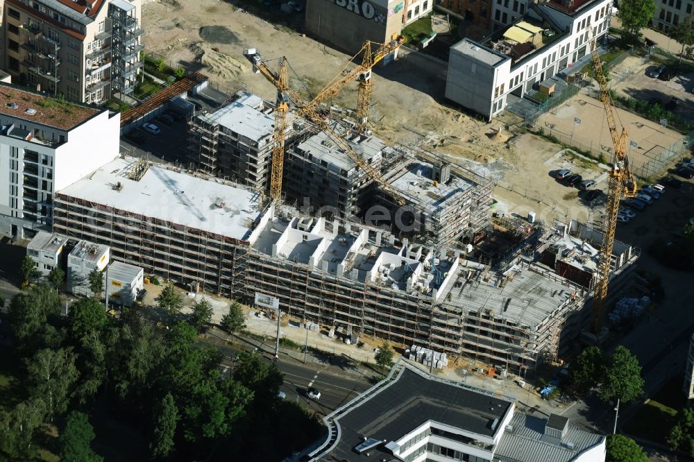 Leipzig from the bird's eye view: Gutted buildings on the area of a former printing plant in Leipzig in the state Saxony. The old buildings are part of a housing project