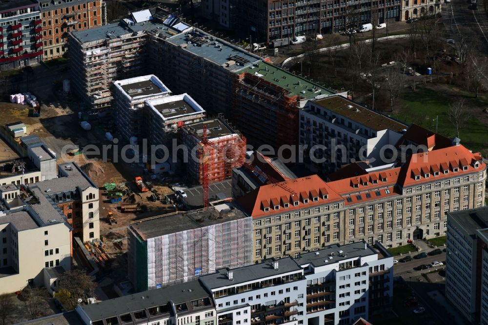 Leipzig from the bird's eye view: Gutted buildings on the area of a former printing plant in Leipzig in the state Saxony. The old buildings are part of a housing project