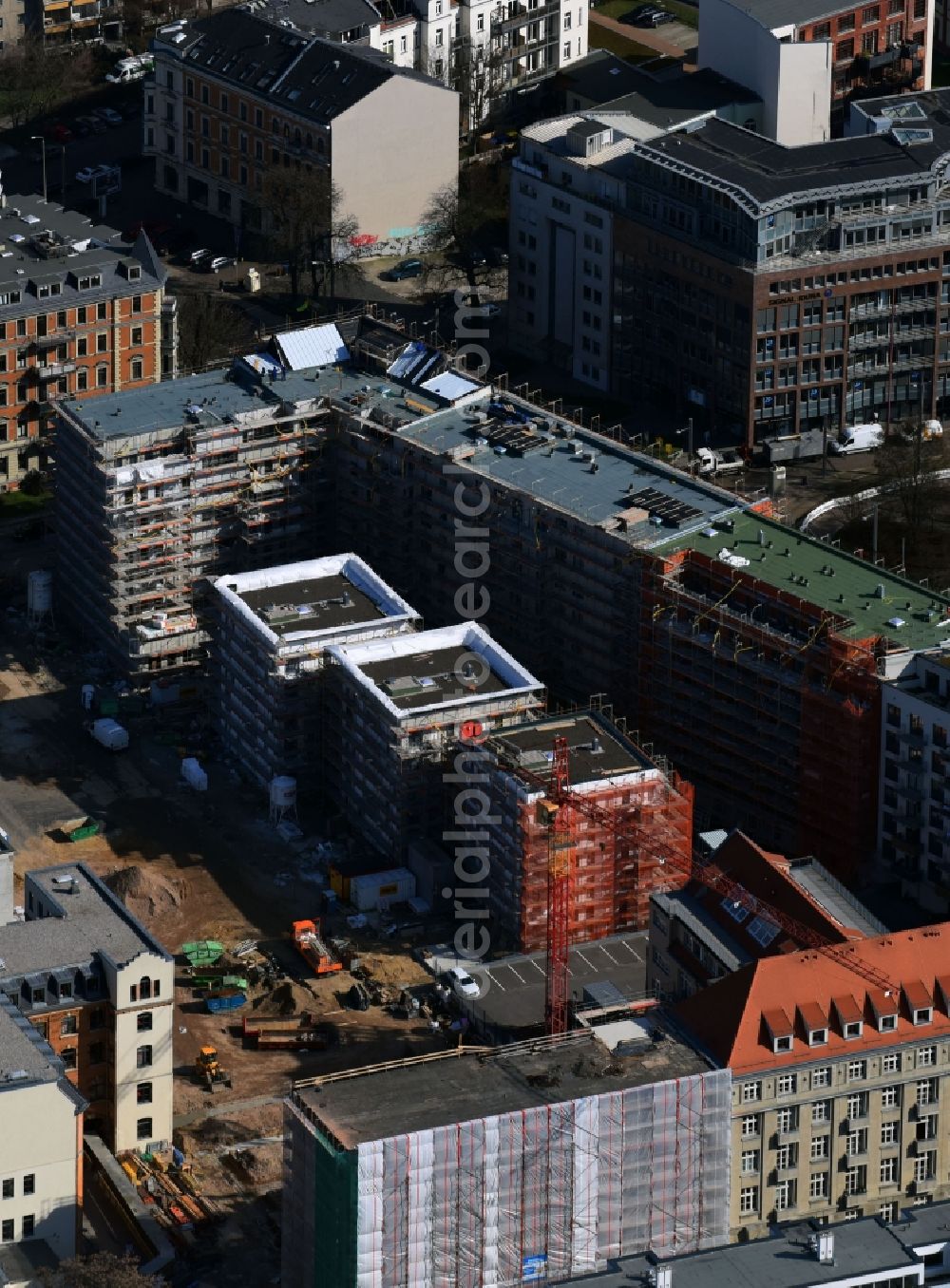 Leipzig from the bird's eye view: Gutted buildings on the area of a former printing plant in Leipzig in the state Saxony. The old buildings are part of a housing project