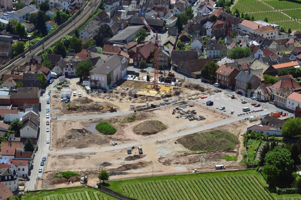 Nierstein from above - Construction site at the location of the former malt factory in the town of Nierstein in the county district of Mainz-Bingen in the state of Rhineland-Palatinate. Originally built as a palace and residence in classicist style, the palace Dalberg - Herding was used as an administrative building an office for the local malt factories. The site is currently refurbished and will be redesigned as a residential compund called Am Schlosspark