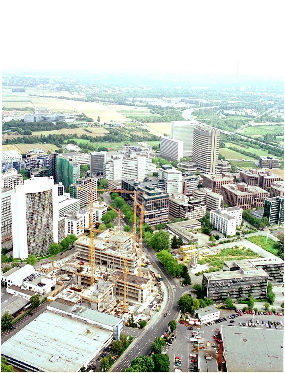 Aerial photograph Eschborn - 24.07.2004 Blick auf die Baustelle am Gewerbegebiet der HVB Immobilien AG am Eschborner Dreieck in Frankfurt Sossenheim. Beeindruckende Immobilie mit Symbolcharakter. Seit Oktober 2002 realisieren wir als Generalunternehmer für HOCHTIEF Projektentwicklung die Zentrale der EUROHYPO AG. Mit dem Umzug in die neue Firmenzentrale im Frühjahr 2004 wachsen die Hypothekenbanken der Commerzbank, der Deutschen Bank sowie der Dresdner Bank in Eschborn zusammen.