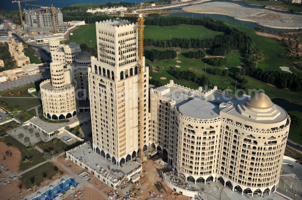 Ras Al Khaimah from above - Construction site of the Al Hamra Palace Hotel in the arab emirate Ras Al Khaimah. The hotel is part of the Al Hamra Village Project, the second largest construction project of Ras Al Khaimah. The project is realized by the state-owned company Al Hamra Real Estate