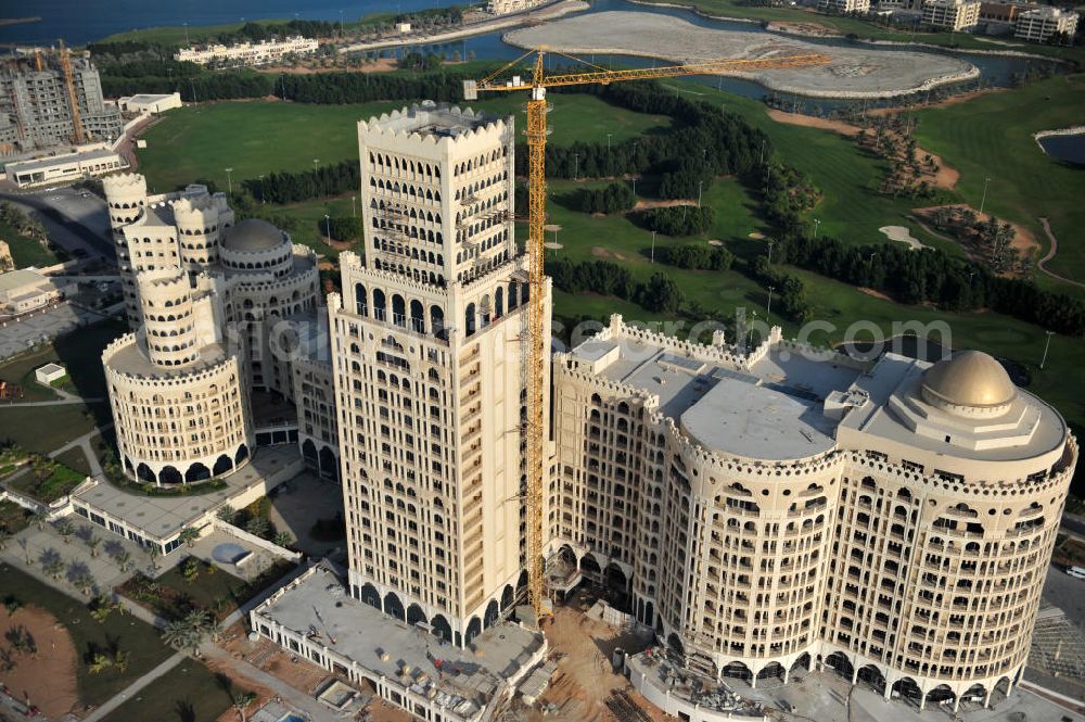 Ras Al Khaimah from the bird's eye view: Construction site of the Al Hamra Palace Hotel in the arab emirate Ras Al Khaimah. The hotel is part of the Al Hamra Village Project, the second largest construction project of Ras Al Khaimah. The project is realized by the state-owned company Al Hamra Real Estate