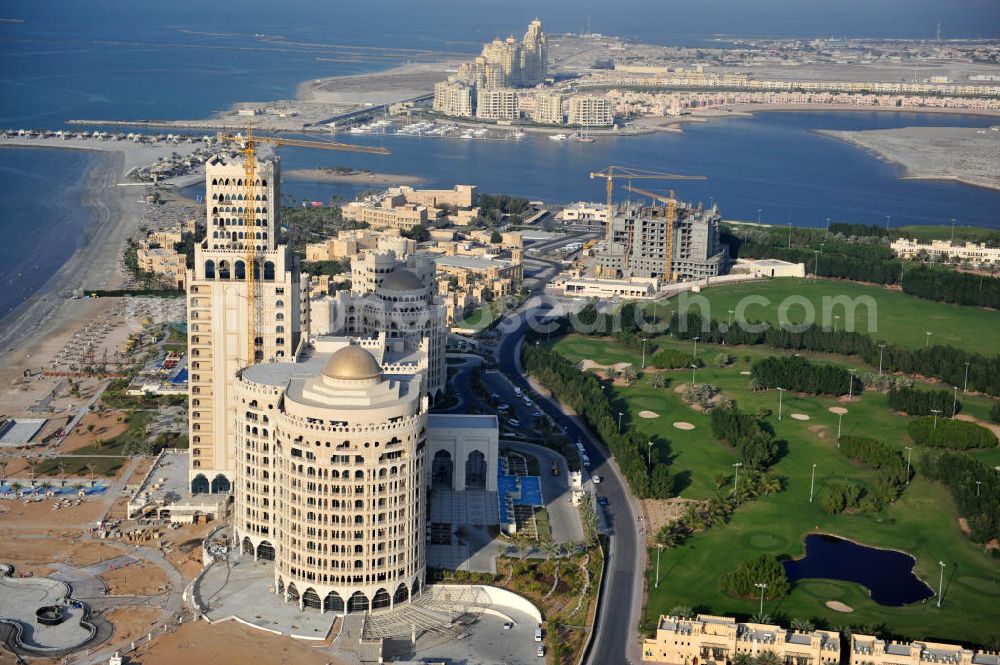 Aerial photograph Ras Al Khaimah - Construction site of the Al Hamra Palace Hotel in the arab emirate Ras Al Khaimah. The hotel is part of the Al Hamra Village Project, the second largest construction project of Ras Al Khaimah. The project is realized by the state-owned company Al Hamra Real Estate